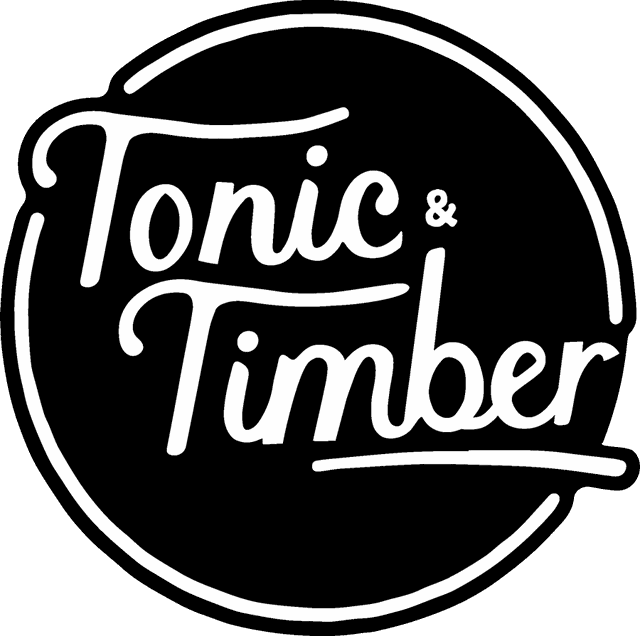 Tonic & Timber script logo in a black circle